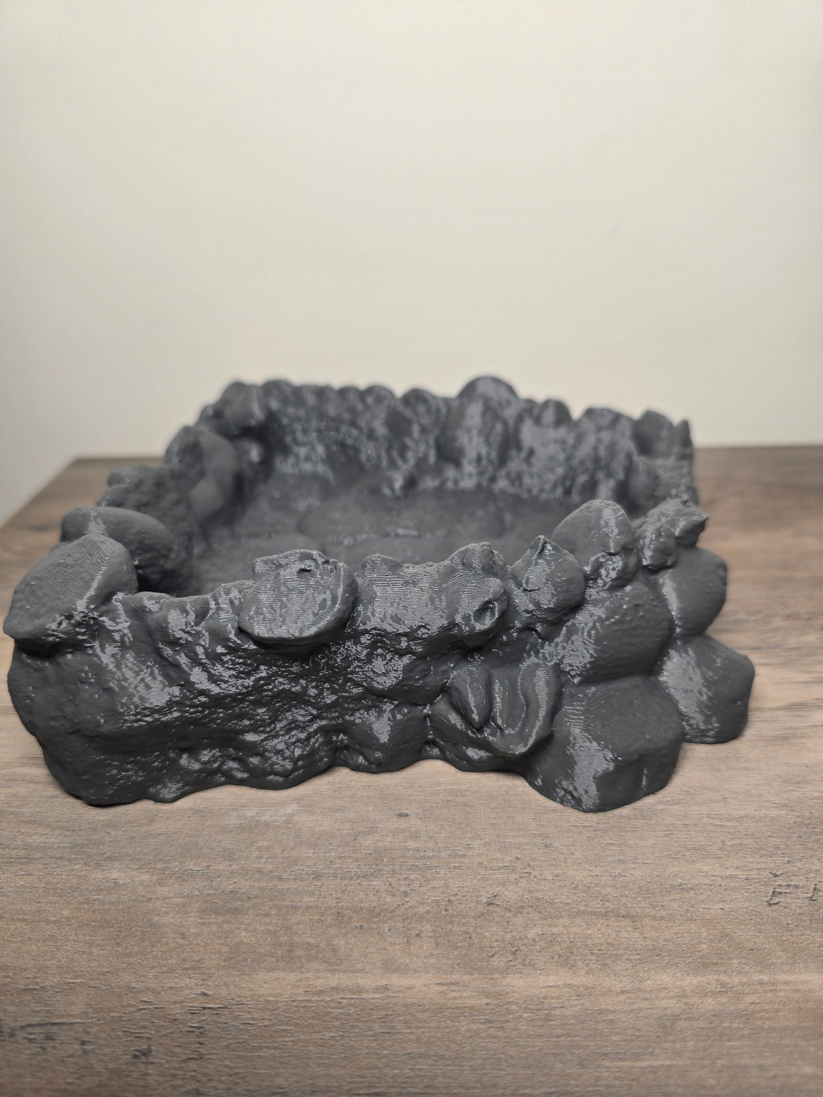 Dark gray reptile corner water bowl with a textured rock-look rim