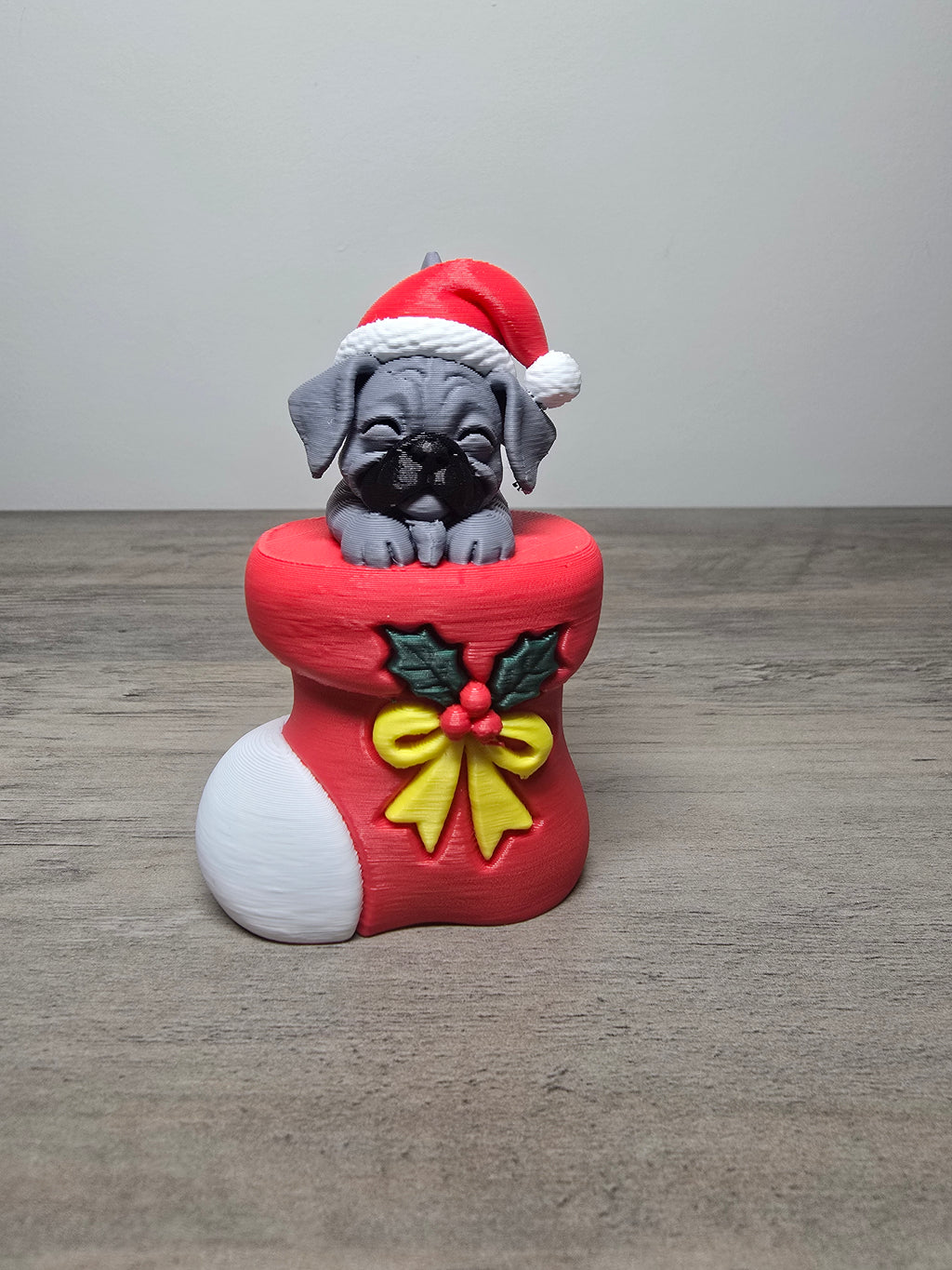 Digitally painted boxer puppy Christmas ornament wearing a Santa hat in a red stocking