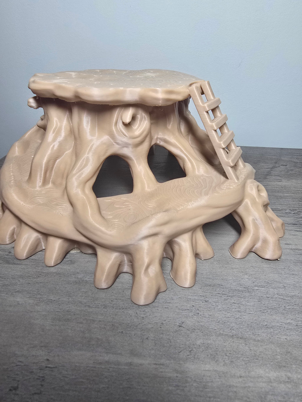 Tree stump aquarium hideaway with bark-style texture, root-shaped supports, multiple openings, and a miniature ladder